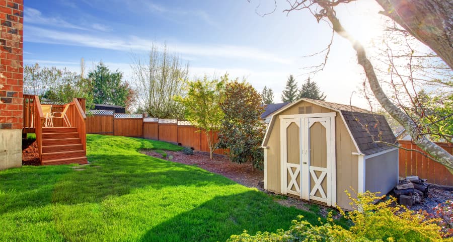 Fenced backyard with storage shed in Scranton